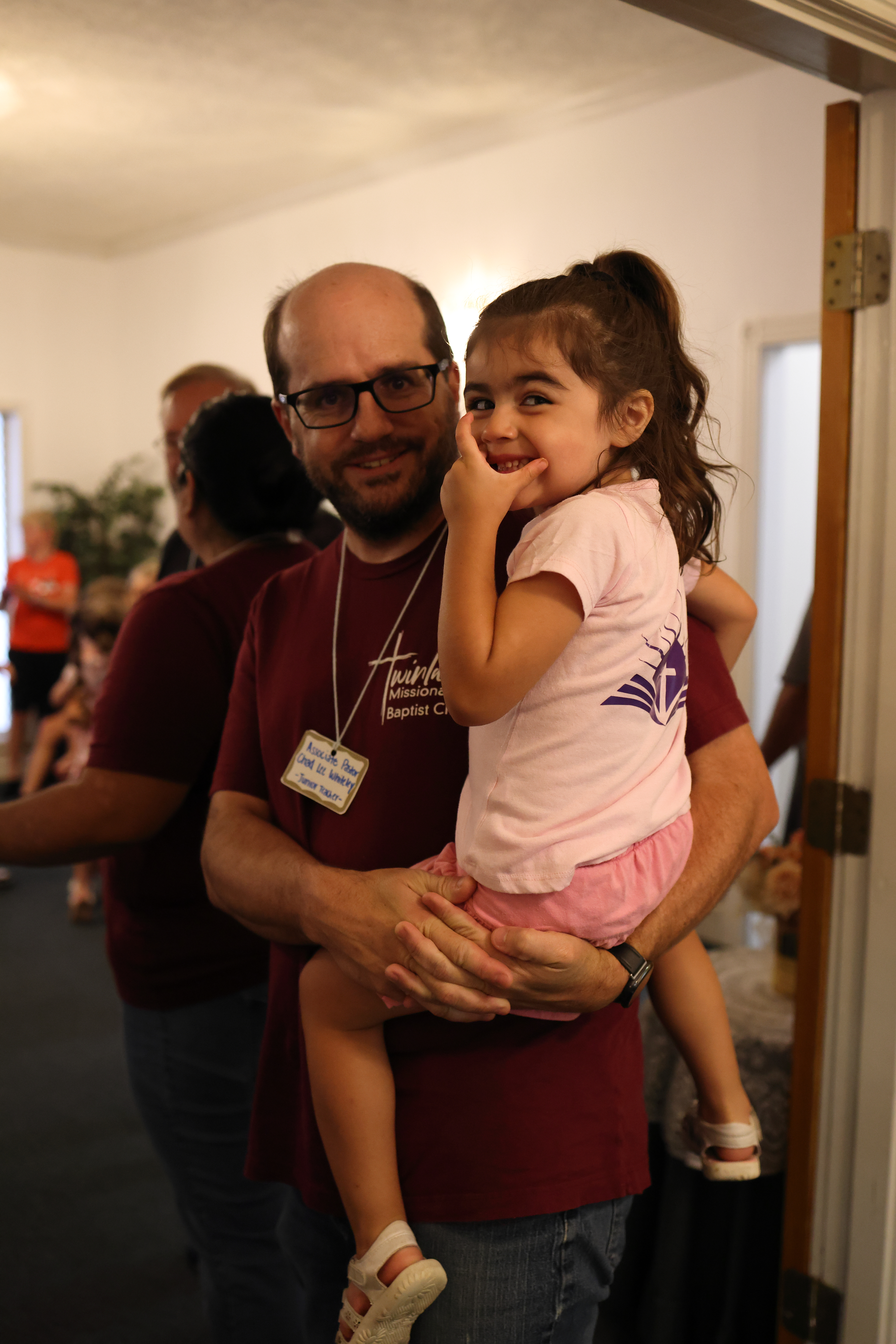 Father holding his young daughter