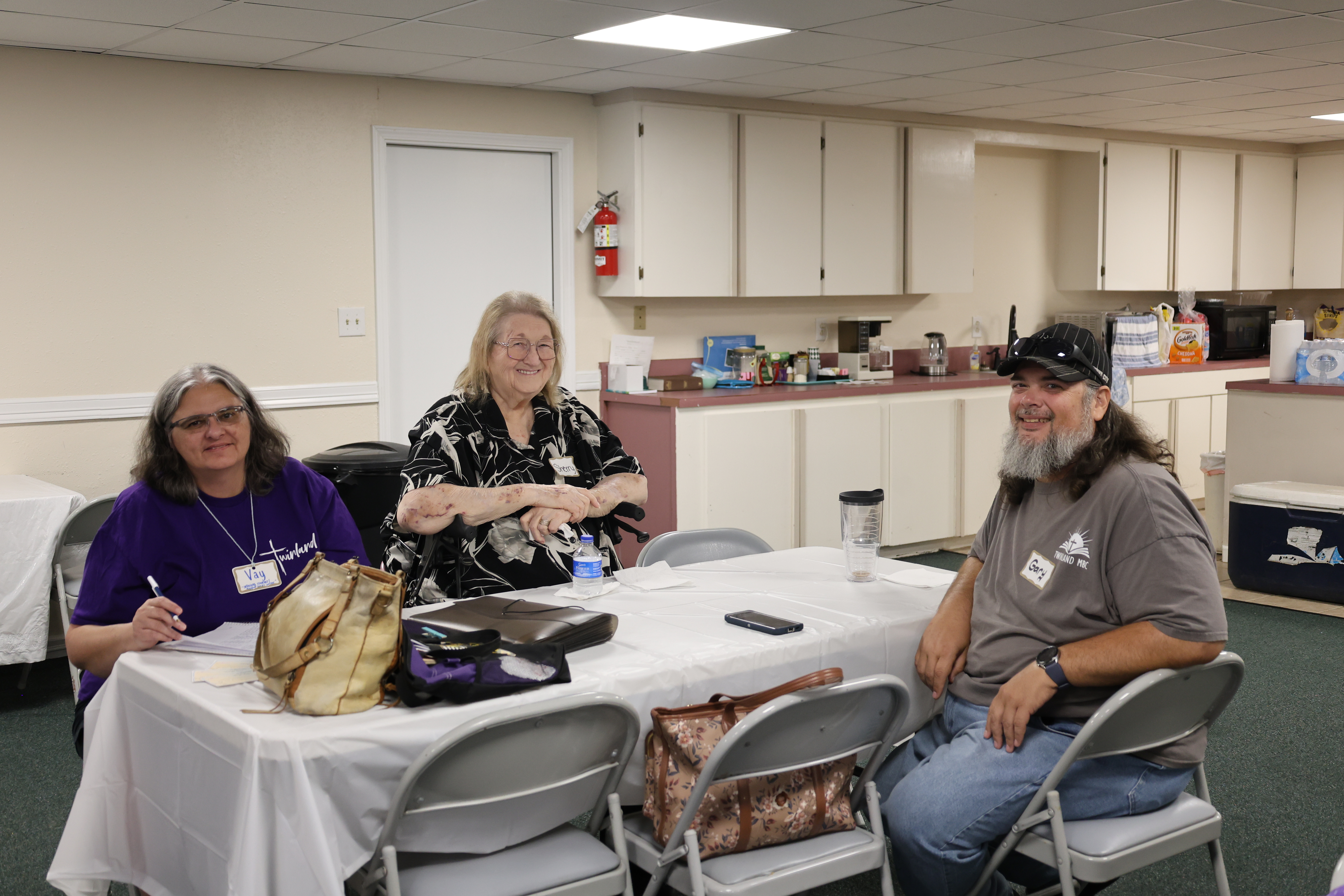 Adults enjoying fellowship around a table