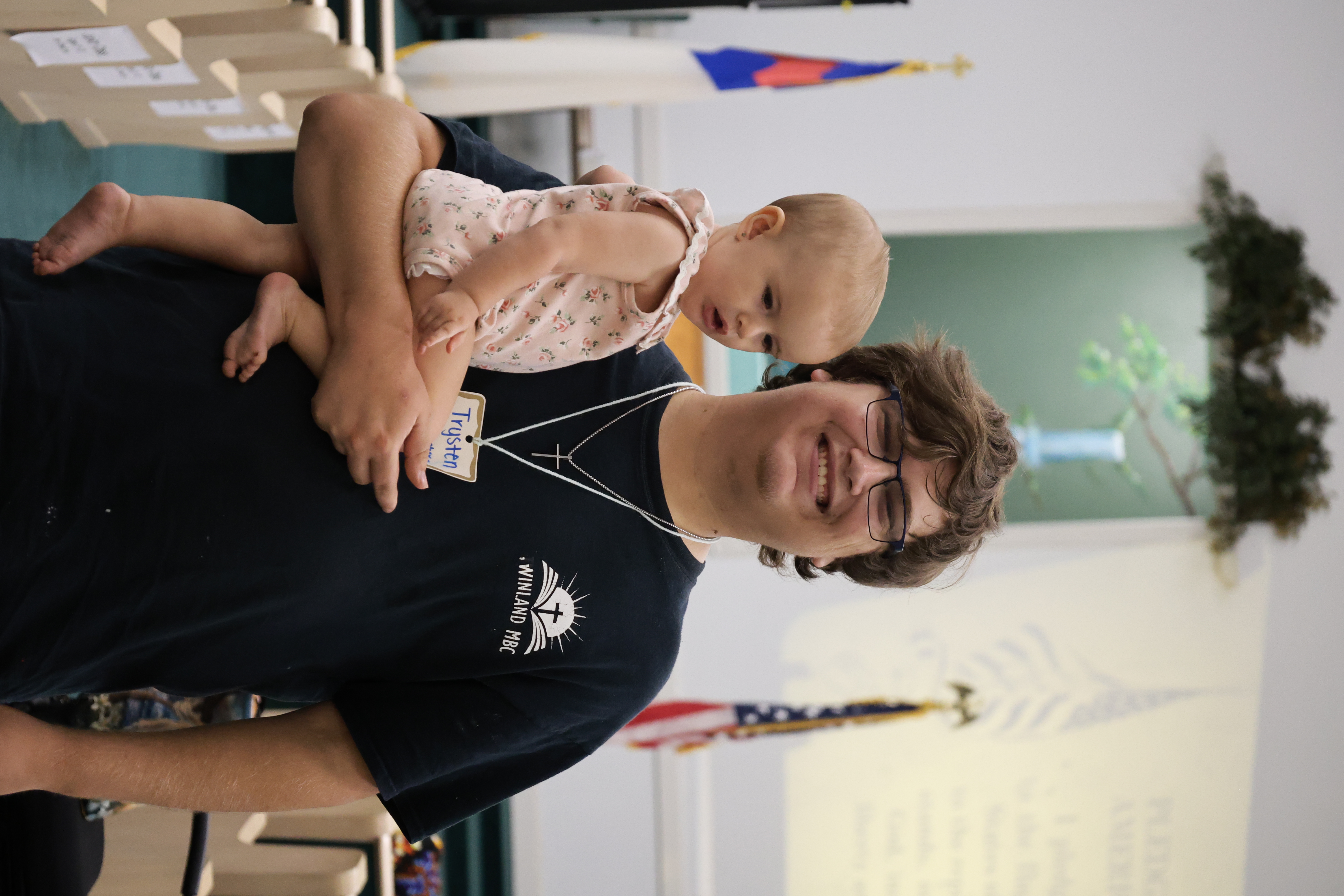 Church volunteer holding a baby