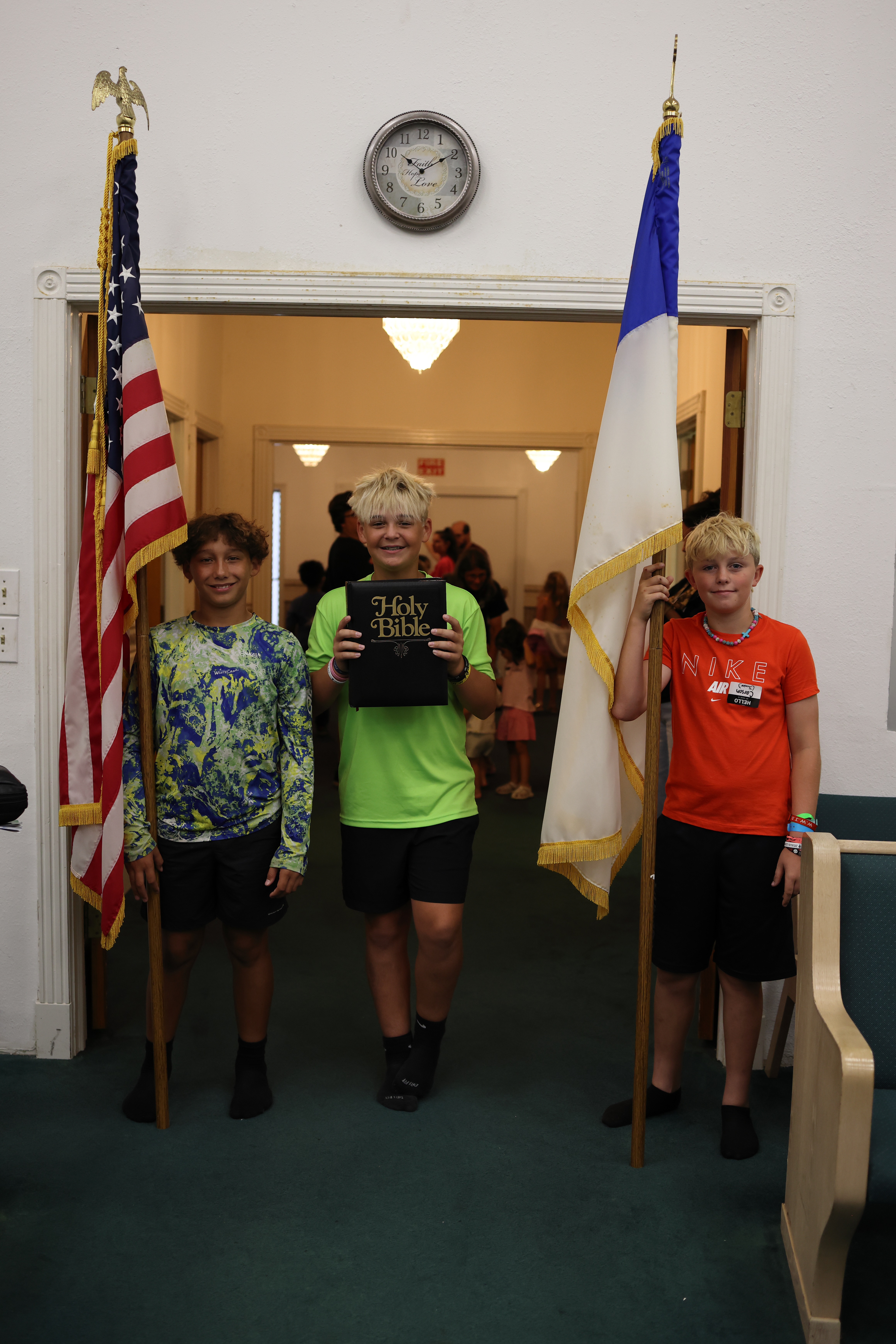 Twinland youth participating in a flag procession