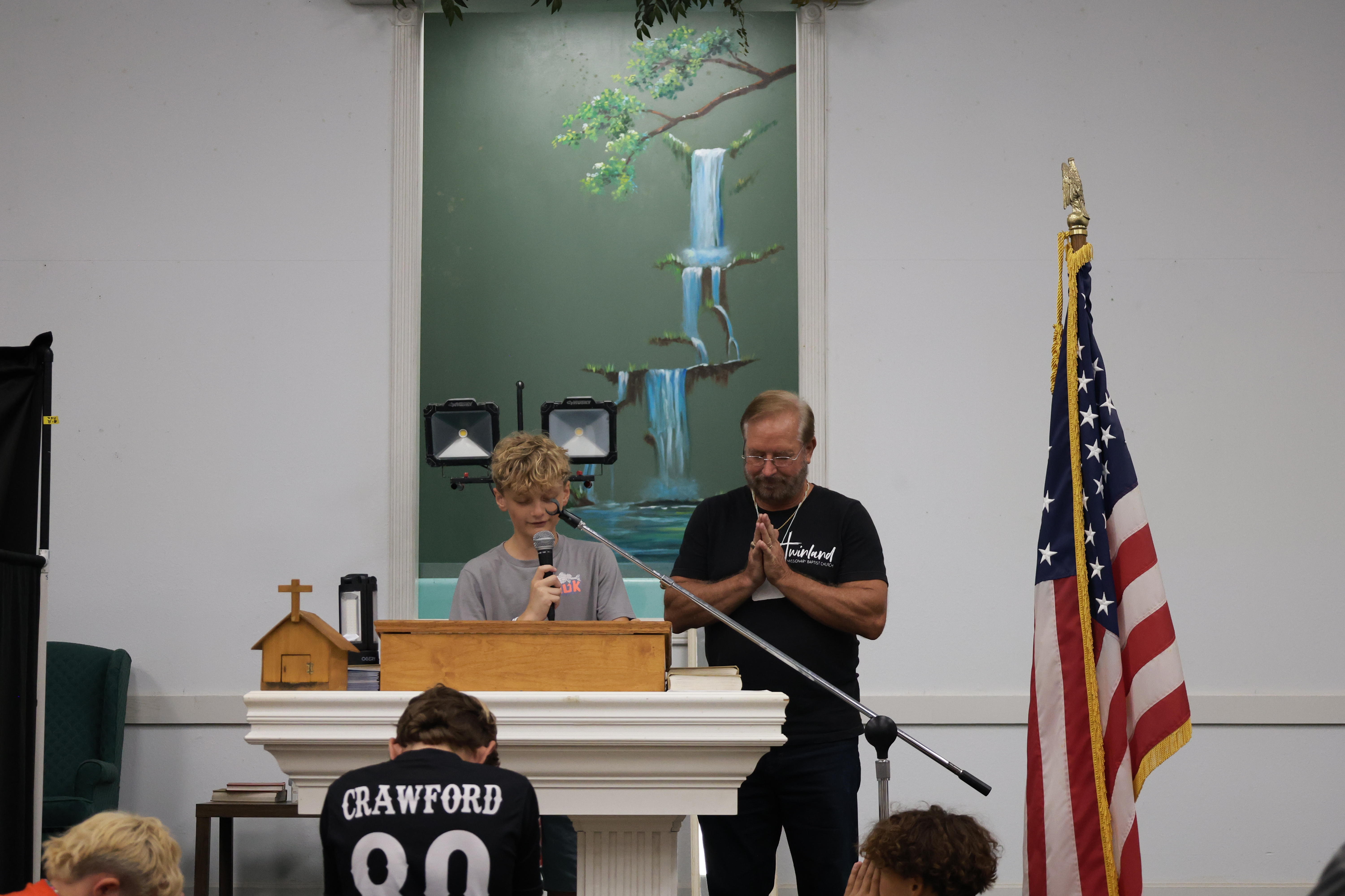 Young person speaking at the church pulpit